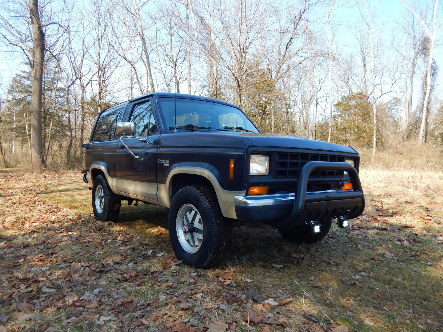 1988 Blue /Tan Ford Bronco II 4WD (1FMCU14T6JU) with an 2.9L V6 OHV 12V engine, 4-Speed Automatic Overdrive transmission, located at 6528 Lower York Road, New Hope, PA, 18938, (215) 862-9555, 40.358707, -74.977882 - Here we have a 1988 Ford Bronco 2 with a 2.9L V6 putting power to a 4x4 automatic transmission. Options include: tan cloth interior, heat/AC, XD Vision radio, power windows, cruise control, tilt steering wheel, front/rear defrost windows, spare tire cover, 15 inch alloy wheels with 4 Solarus AP tire - Photo#6